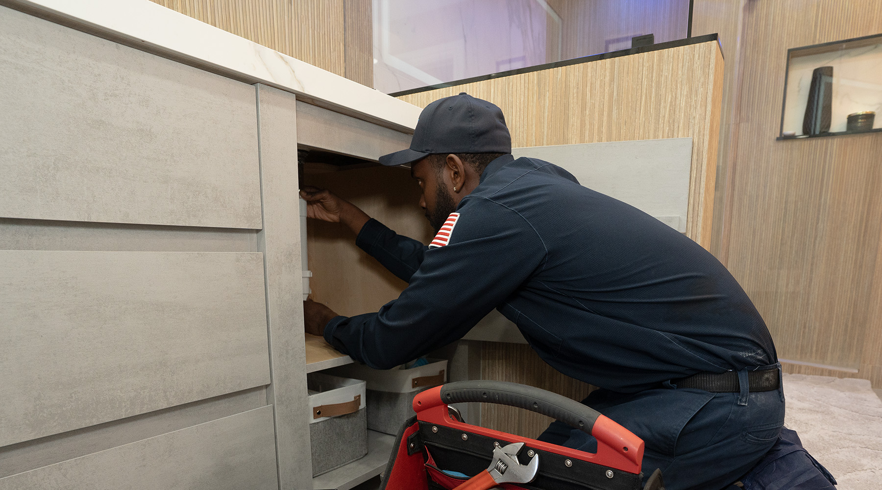 Paramount's plumber fixing a bathroom sink plumbing