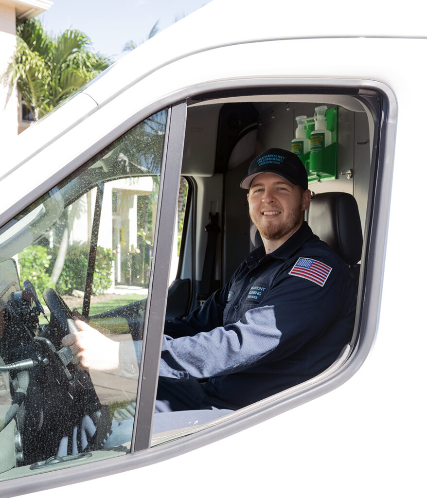 professional plumber in paramount plumbing services van