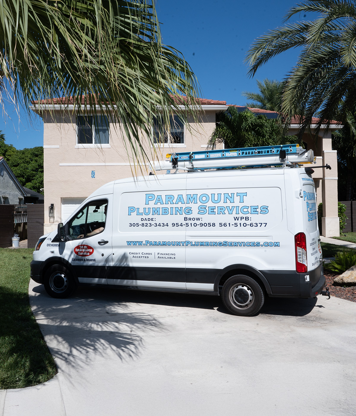Paramount plumbing services van at residential home