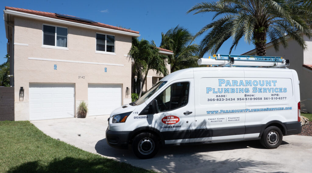 Paramount plumbing services van at residential home