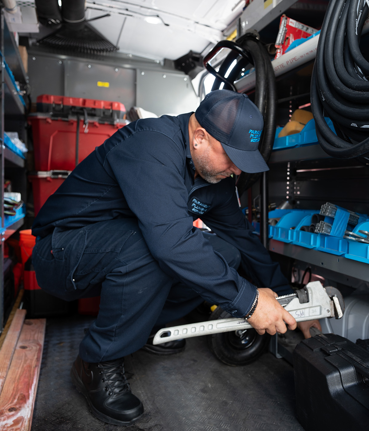 paramount plumber holding wrench in his hand