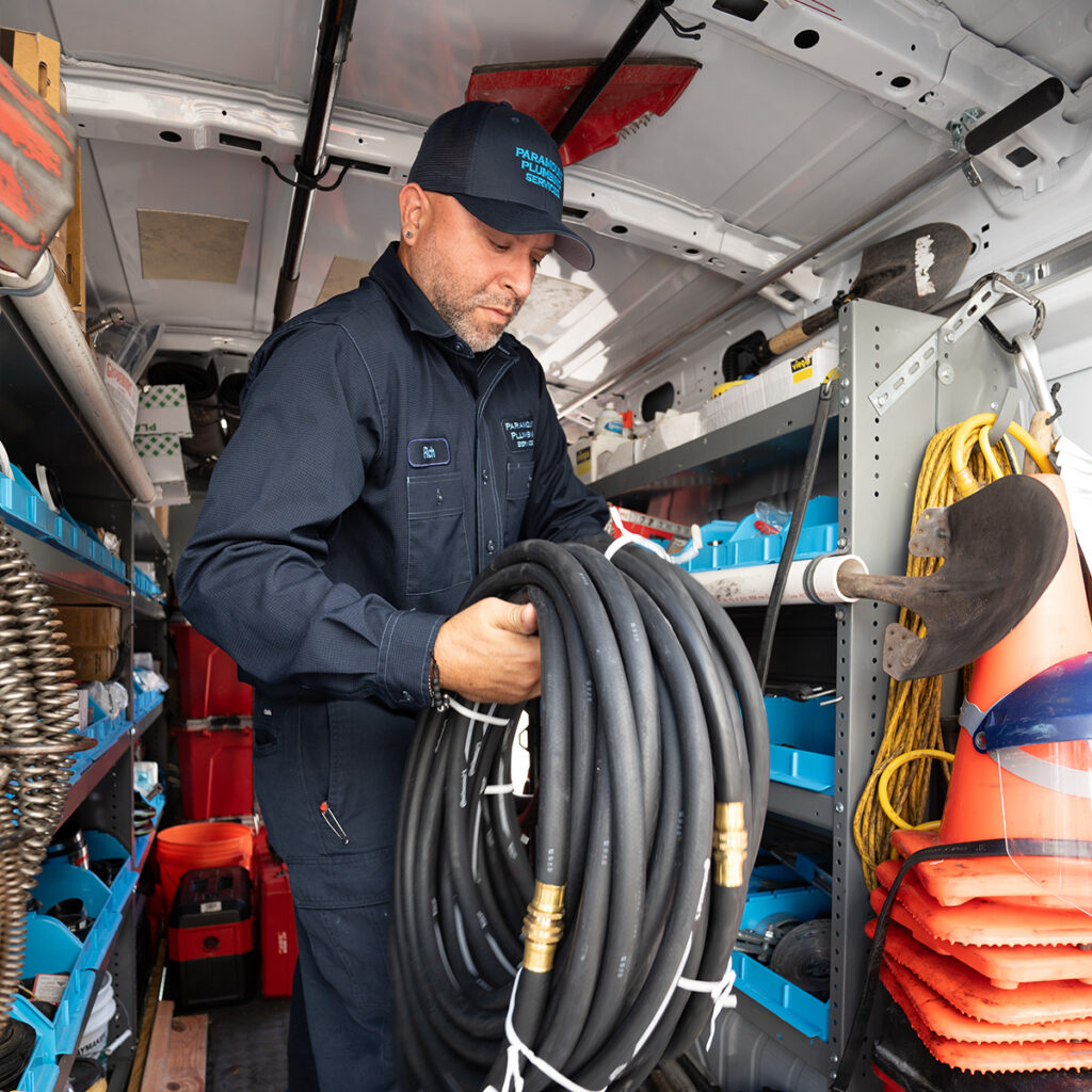 A plumber preparing equipment for a job