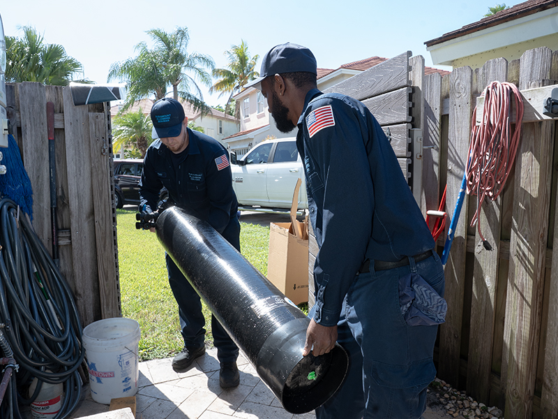 plumbers installing water filtration system