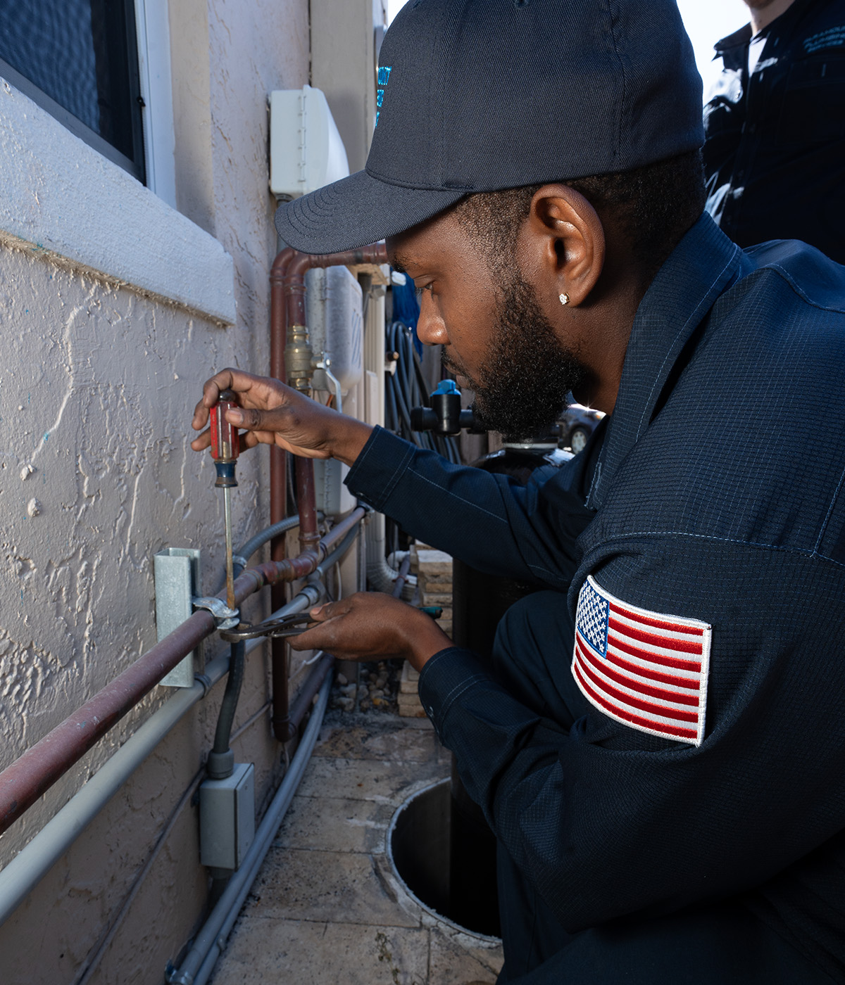 plumber adjusting gas line