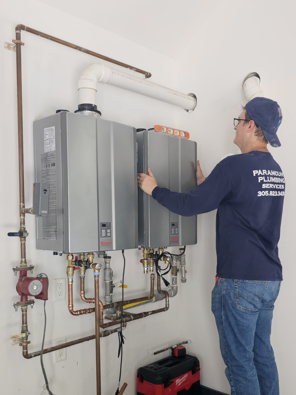 paramount plumbing opening a tankless tank to do maintenance